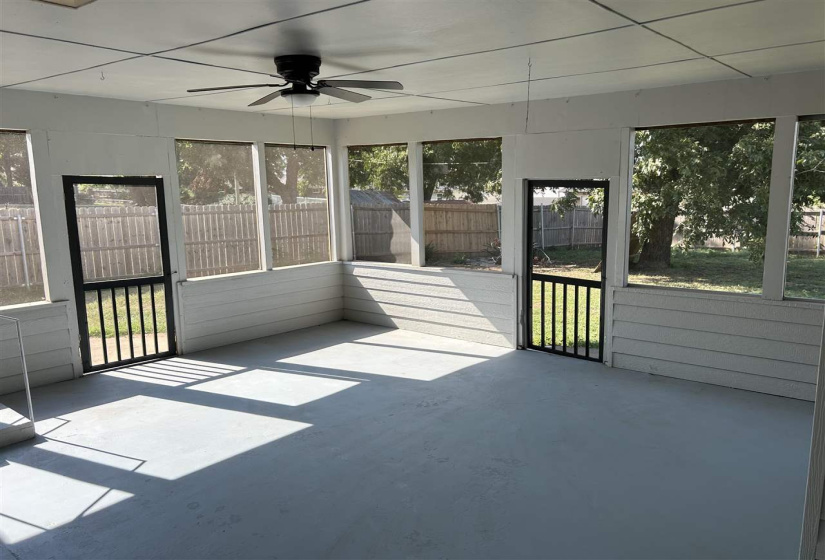screened in back porch access from utility and 2nd living area with fireplace